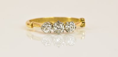 Lot 1212 - An unusual 18ct yellow gold diamond three...