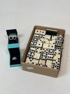 Lot 44 - A set of bone faced dominoes, each piece 5 x 2....
