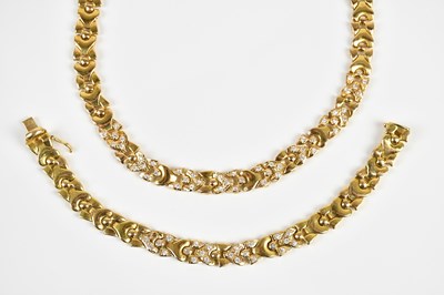 Lot 1586 - An 18ct yellow gold diamond set panel necklace,...