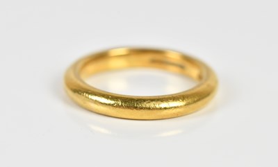 Lot 1353 - A 22ct yellow gold wedding band, size M,...