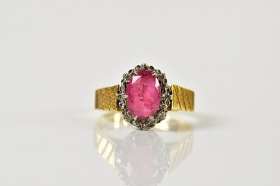 Lot 1388 - An 18ct yellow gold oval cluster ring, with...