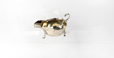 Lot 905 - An Edward VII hallmarked silver sauce boat on...