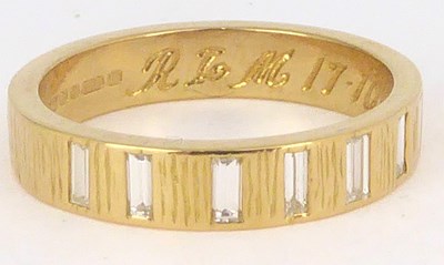 Lot 729 - An 18ct gold half eternity ring