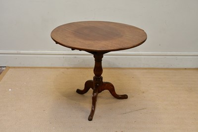 Lot 171 - A Georgian oak tilt-top tripod table with...