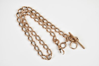 Lot 1595 - A 9ct rose gold Albert chain with T-bar,...