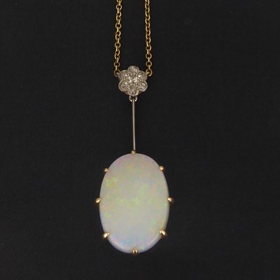 Lot 810 - An early 20th century oval opal and diamond...