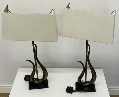 Lot 730 - A pair of contemporary table lamps with 'half'...