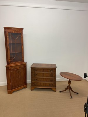 Lot 798 - A reproduction yew wood crossbanded bowfronted...