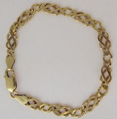 Lot 793 - A 9ct gold flat link bracelet with lobster...