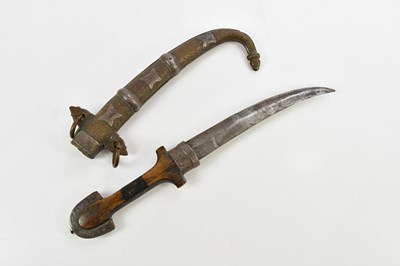 Lot 1366 - An Eastern Jambiya with wooden handle, the...