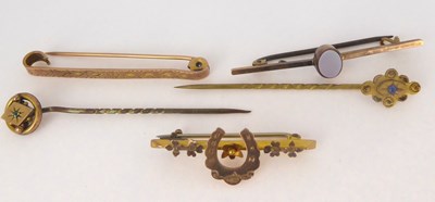 Lot 803 - Three 9ct gold bar brooches comprising one...