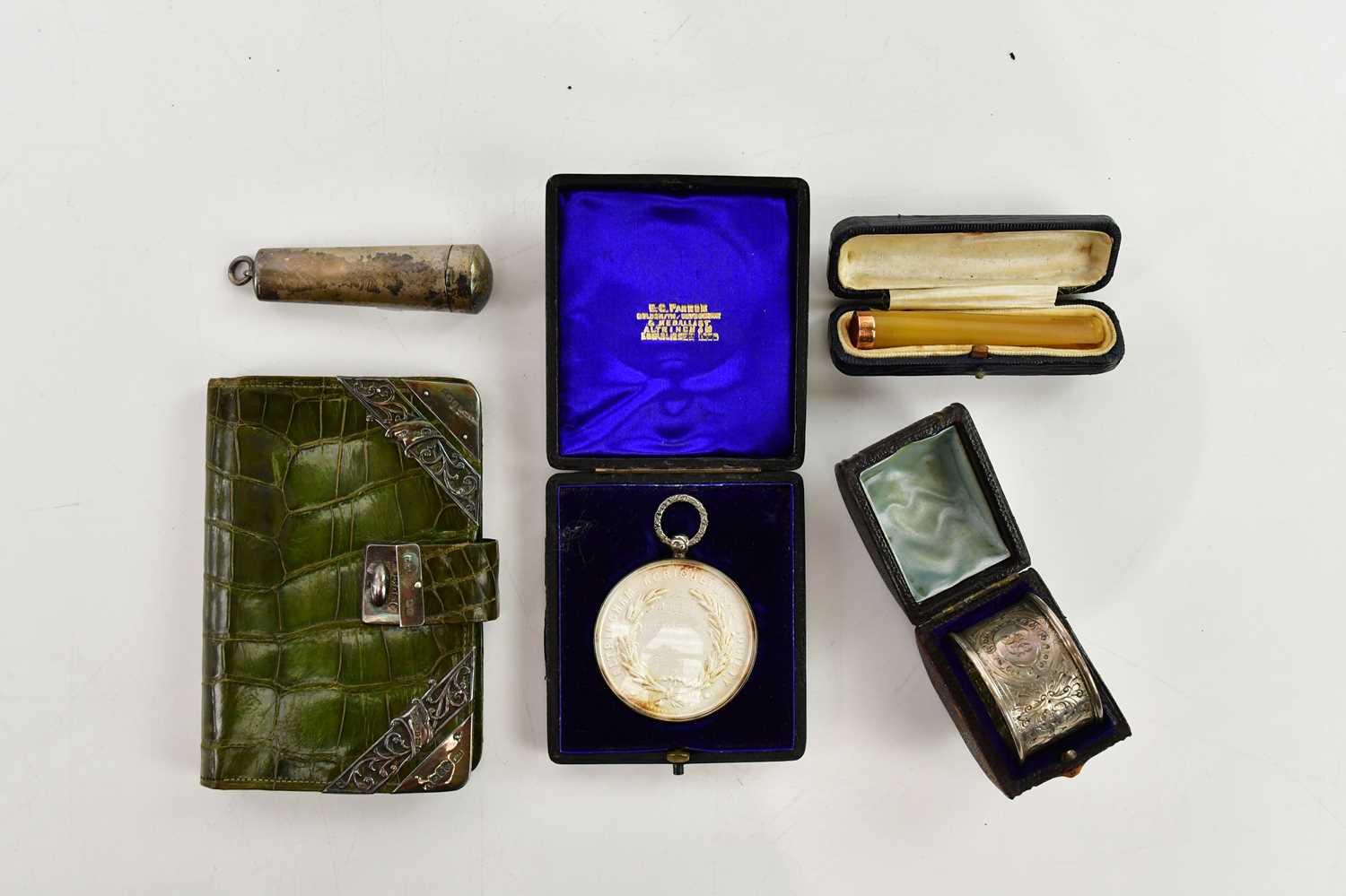 Lot 83 - ALTRINCHAM AGRICULTURAL SOCIETY; a white metal...