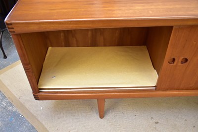 Lot 7 - A mid century teak sideboard with two sliding...