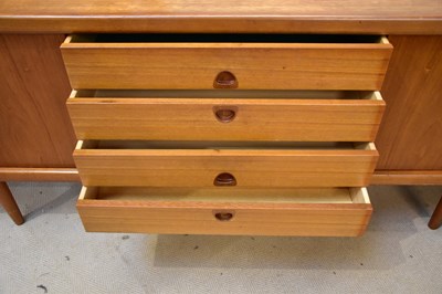 Lot 7 - A mid century teak sideboard with two sliding...