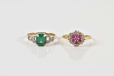 Lot 1519 - A 9ct yellow gold dress ring set with red and...