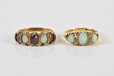 Lot 1471 - A yellow metal diamond and opal set seven...