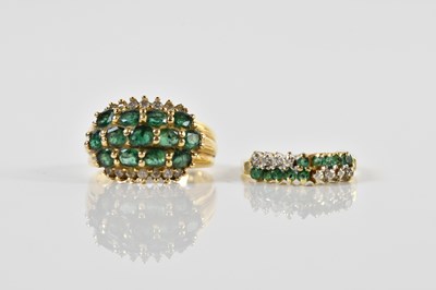 Lot 1350 - Two yellow metal dress rings set with green...