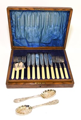Lot 2116 - An oak cased canteen of silver plated fish...