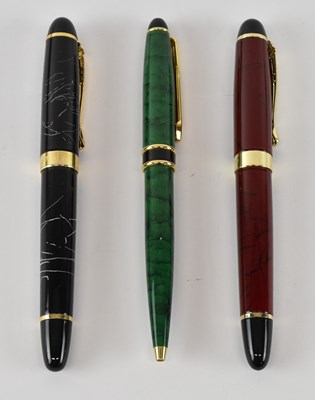 Lot 303 - JINHAO; a red fountain pen with 18ct yellow...