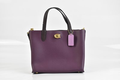 Lot 2028 - COACH; a deep berry pebbled leather unused...