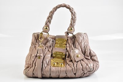 Lot 2040 - MIU MIU; a pink leather Matelassé handbag,...