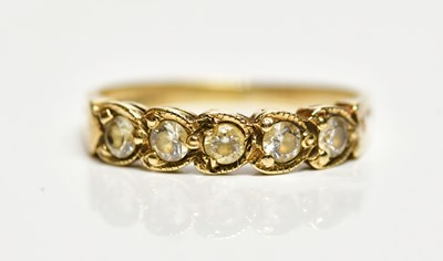 Lot 175 - A 9ct yellow gold cubic zirconia dress ring,...