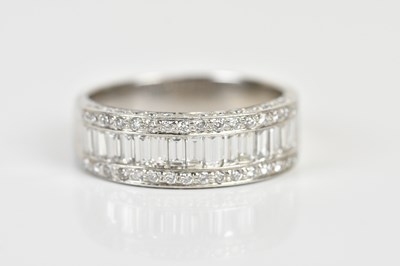Lot 1282 - A white metal diamond ring, with triple half...