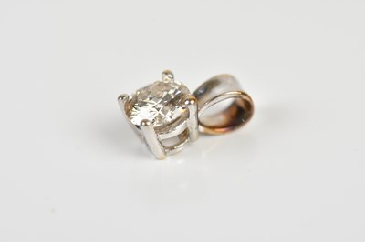 Lot 1621 - A white metal diamond pendant, the four claw...