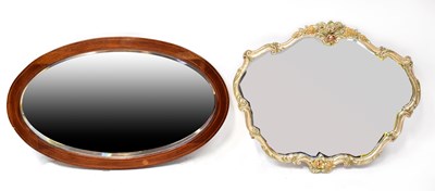 Lot 111 - An Edwardian inlaid mahogany oval wall mirror...