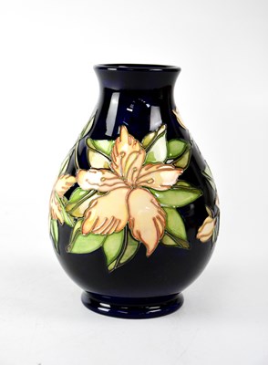 Lot 291 - MOORCROFT; a baluster vase with cobalt blue...