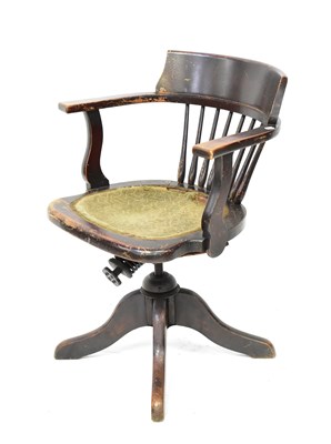 Lot 41 - An early 20th century spindle back swivel desk...