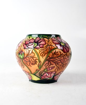 Lot 284 - MOORCROFT; a baluster vase with mulitcoloured...