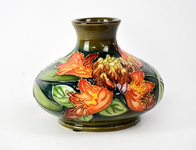 Lot 285 - MOORCROFT; a squat baluster vase, green ground...