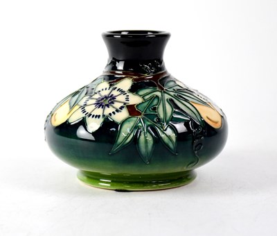 Lot 286 - MOORCROFT; a squat baluster vase, green drip...