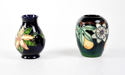 Lot 287 - MOORCROFT; a baluster vase, green drip glaze...