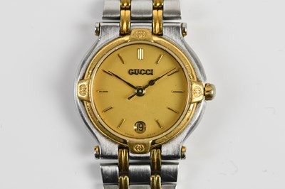 Lot 1885 - GUCCI; a lady's bimetallic fashion watch, no...