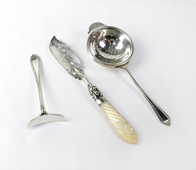 Lot 672 - A hallmarked silver tea strainer