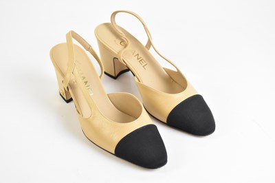 Lot 795 - CHANEL; a pair of tan calfskin leather and...