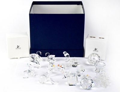 Lot 353 - SWAROVSKI; fourteen crystal figures of varying...