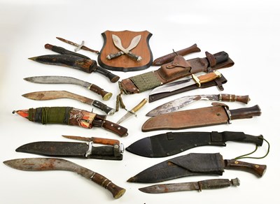 Lot 1345 - A collection of knives including kukris, Bowie...