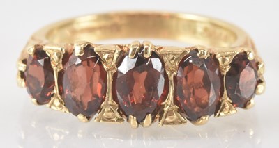 Lot 774 - A 9ct gold ring set with five graduated...