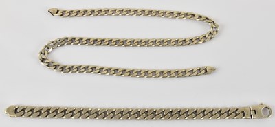 Lot 831 - A silver flat curb necklace with lobster claw...