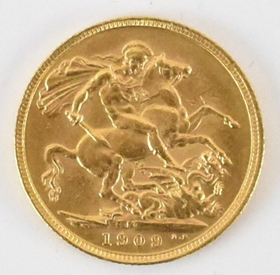 Lot 890 - An Edward VII 1909 full sovereign, George and...