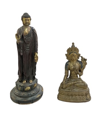 Lot 563 - A gilt metal Tibetan figure of Buddha, height...