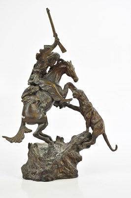Lot 2686 - A bronze figure group of a mountain man on...