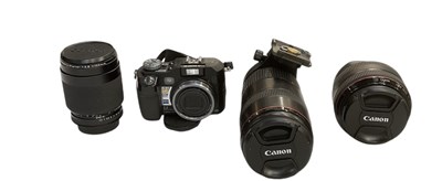 Lot 302 - CANON; an 80-200mm cased macro lens, a 100mm...