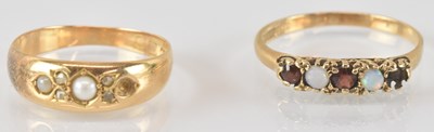 Lot 807 - Two gold rings comprising an 18ct seed pearl...
