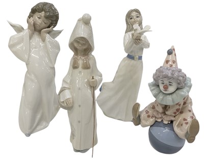 Lot 497 - LLADRÓ; three porcelain figures comprising an...