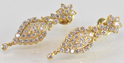 Lot 720 - A pair of yellow metal drop earrings, each set...
