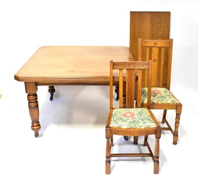 Lot 24 - A Victorian oak wind-out dining table, with...